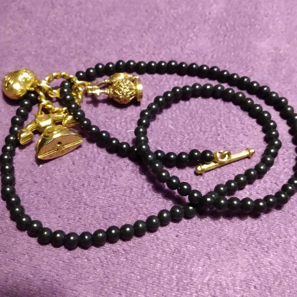 Gold Tone Charmed Black Beaded Necklace